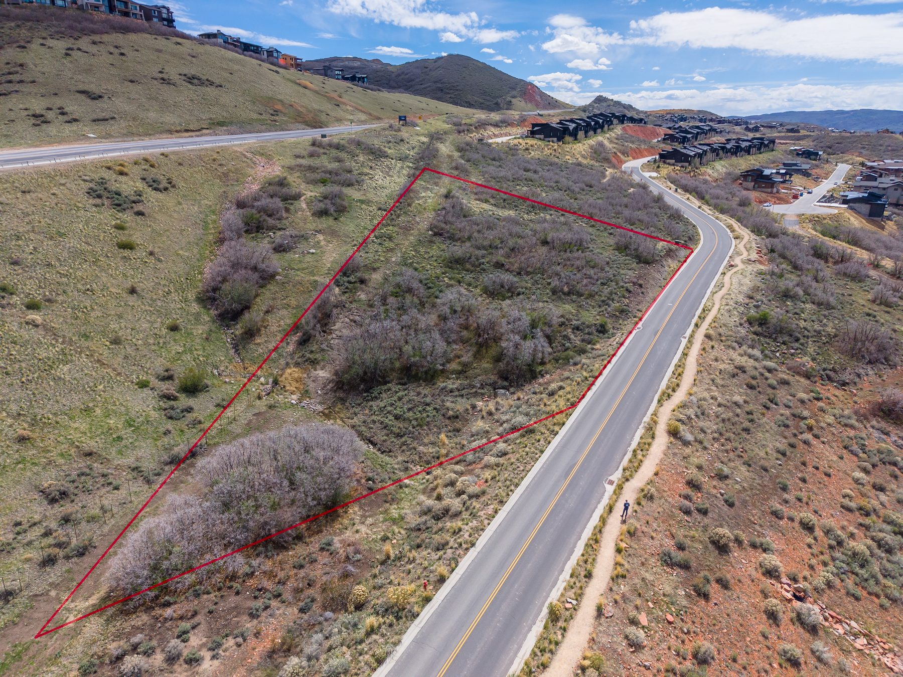 Aerial drone photo with red boundary lines showing the full 1.13-acre parcel at 11422 N Shoreline Drive in Hideout Canyon